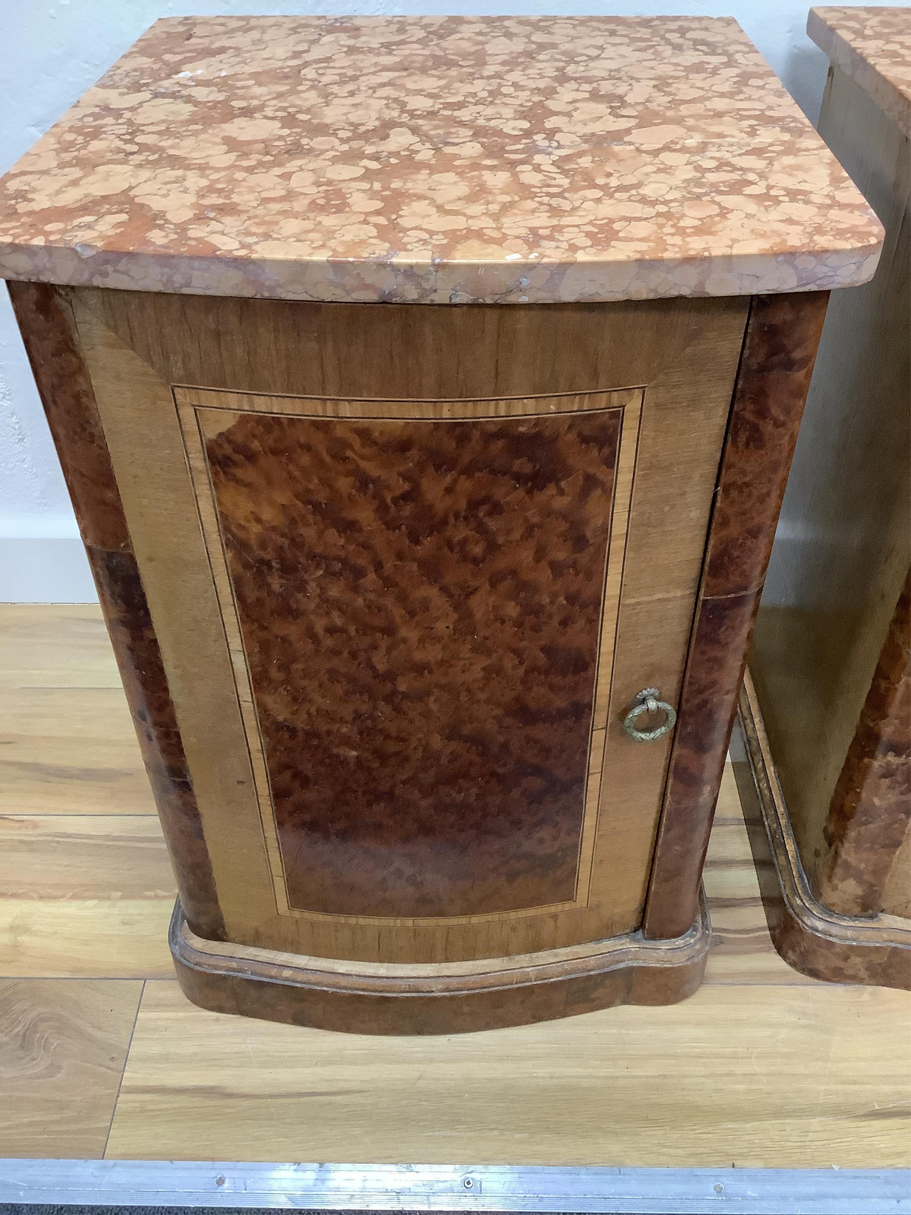 A pair of early 20th century French amboyna and mahogany marble top bedside cabinets, width 40cm, depth 43cm, height 58cm. Condition - fair